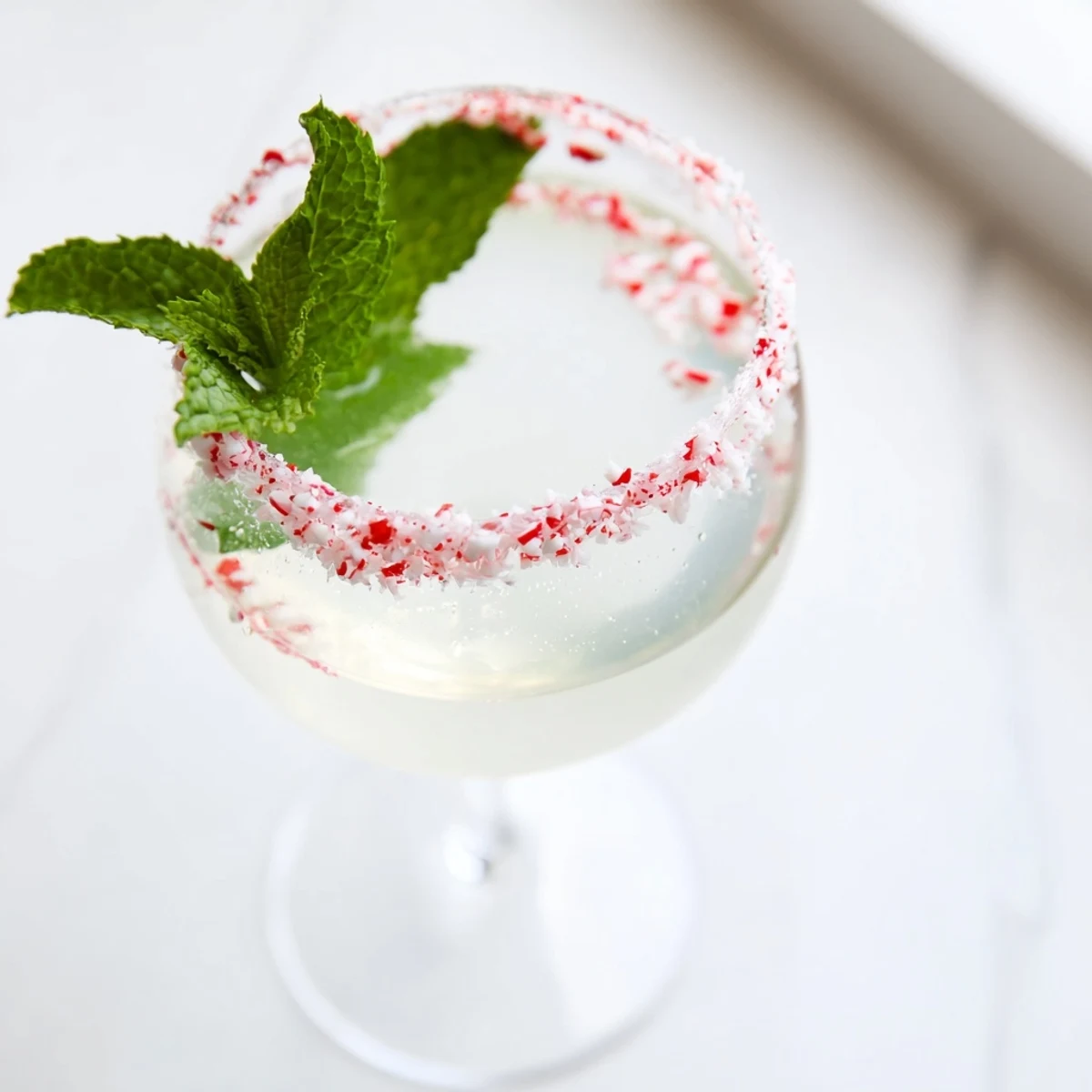 Expertly poured Peppermint Drop with vodka and peppermint, ideal for holiday get-togethers.