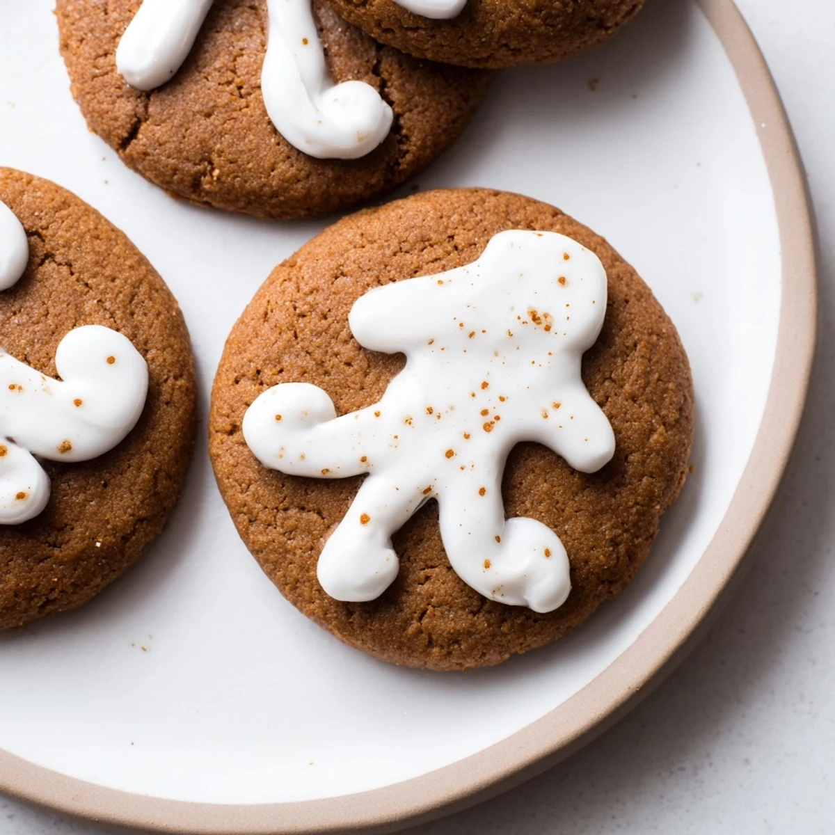 Close-up of golden brown gingerbread cookies, decorated with sweet, colorful icing, delicious and fragrant.