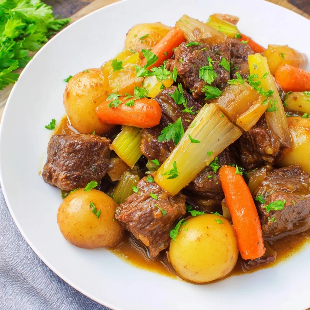 Smell the aroma of slow cooked beef stew, with chunky vegetables and fall-apart beef in a bowl.