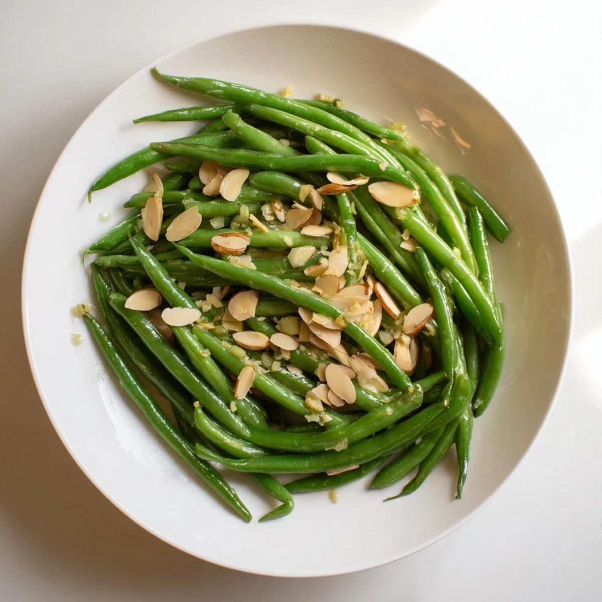 Steaming Garlic Green Beans piled high, offering a fresh, garlicky side dish temptation.