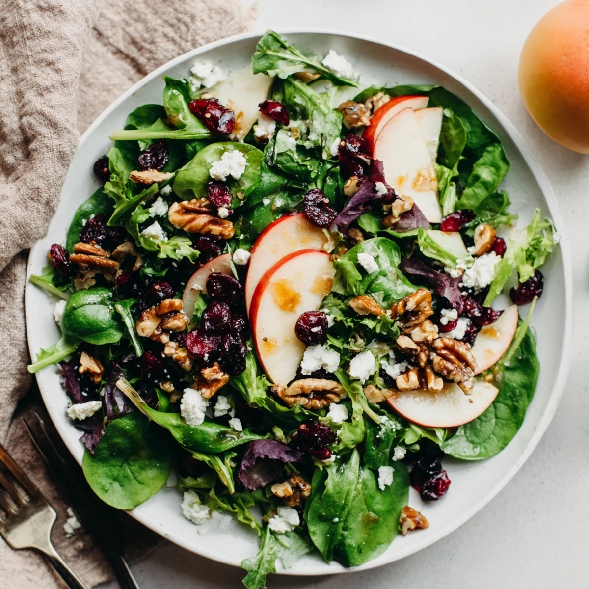 Fresh and vibrant walnut salad with toasted walnuts, colorful fruit, and a light vinaigrette, ready to serve.