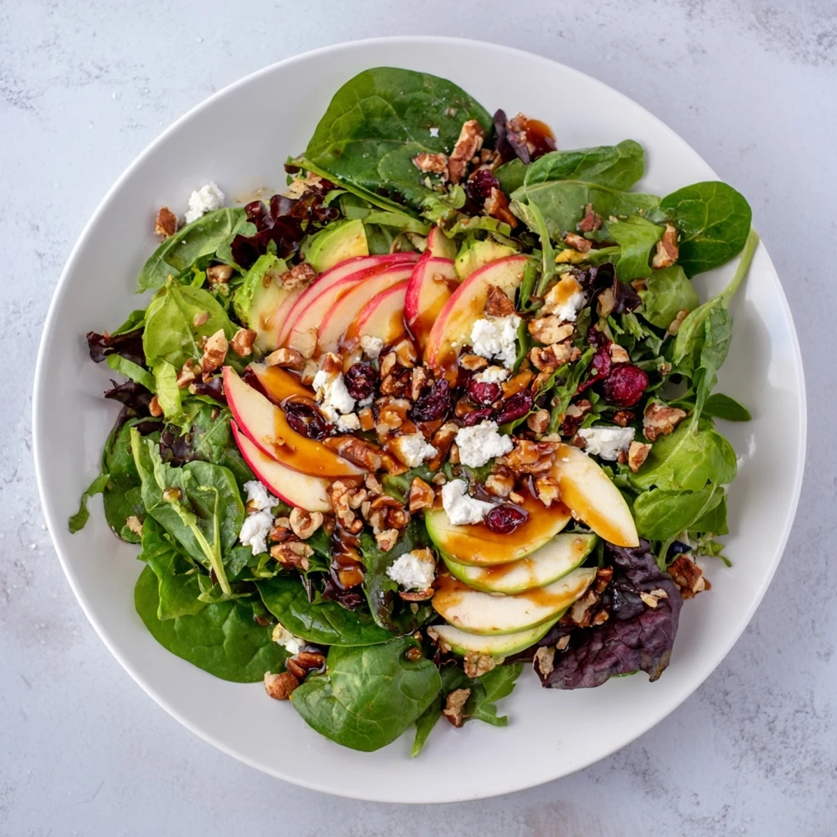 Tossed walnut salad: a close-up shows the delightful crunch of apples and walnuts in a perfect bite.