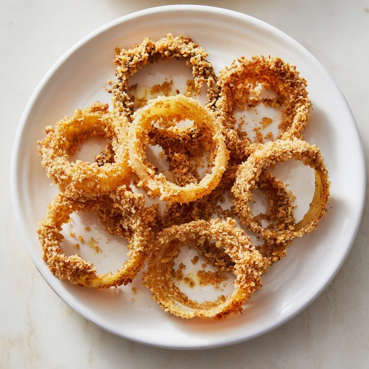Crunchy baked onion rings with a wonderfully crispy breading, ready to dip and enjoy.