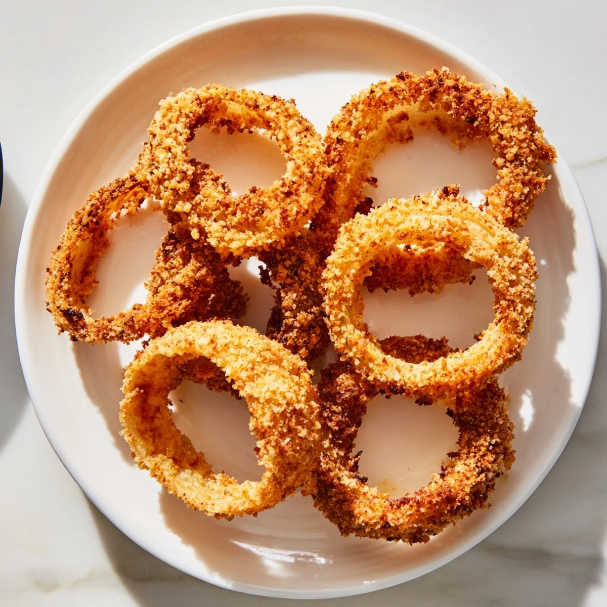 Freshly baked onion rings, offering a healthier, satisfying alternative to deep-fried versions.