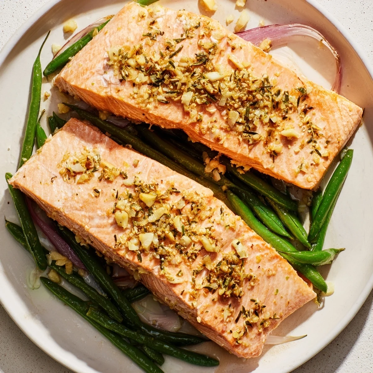 Sheet Pan Salmon and Green Beans, sizzling with lemon and herbs, ready to be served from the pan.