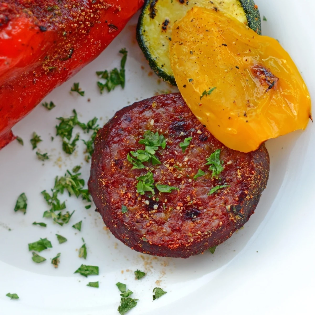 Halal Sausage and Veggies on a sheet pan with zucchini and cherry tomatoes, ready for a quick dinner.