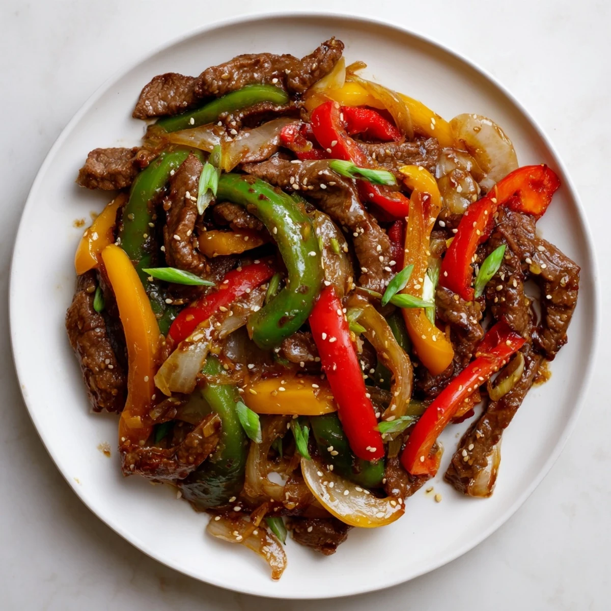 Hot from the wok, this spicy beef and pepper stir fry pairs perfectly with fluffy steamed rice.  