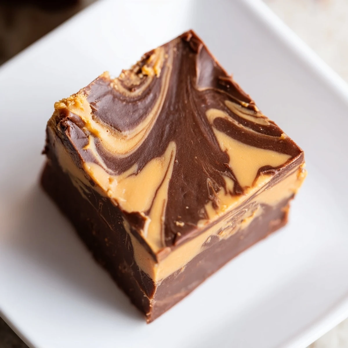 Smooth layers of Chocolate Peanut Butter Fudge, cut into neat pieces perfect for a party platter or gift.