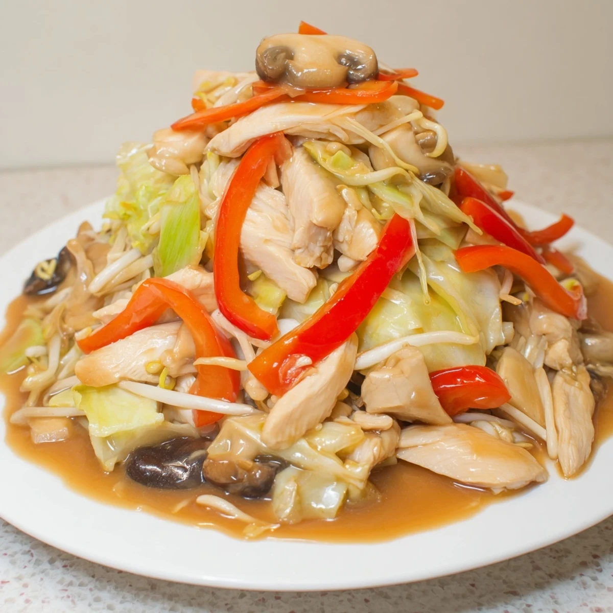 Sizzling wok full of homemade Chop Suey featuring sliced meat, vibrant bell peppers, bean sprouts, and cabbage coated in rich brown sauce