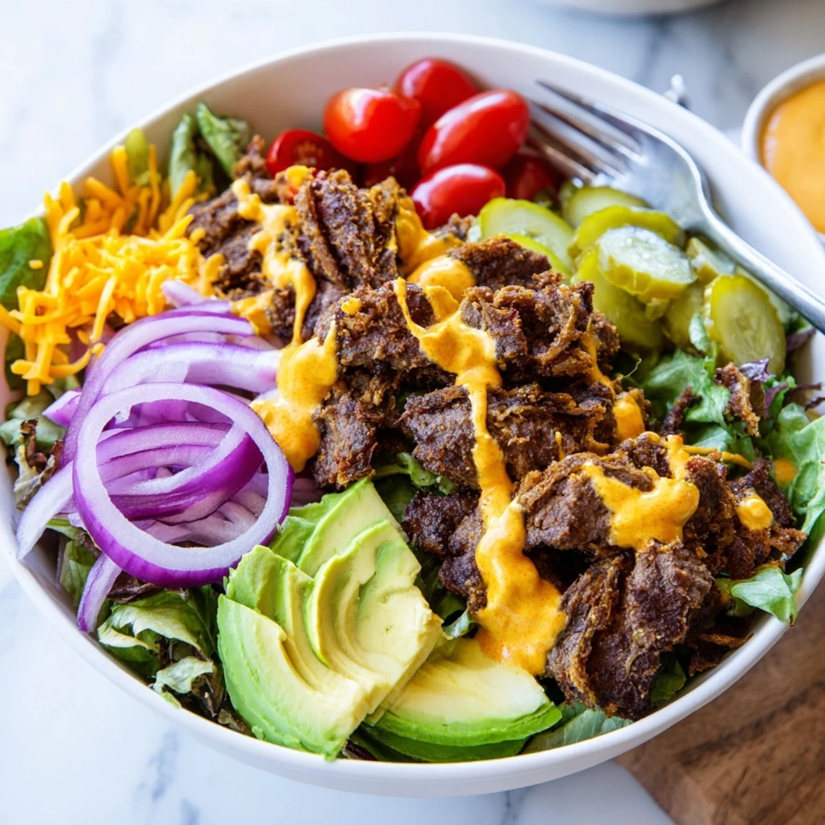 Golden crispy smash burger patties nestled over fresh greens with tangy pickles and creamy sauce