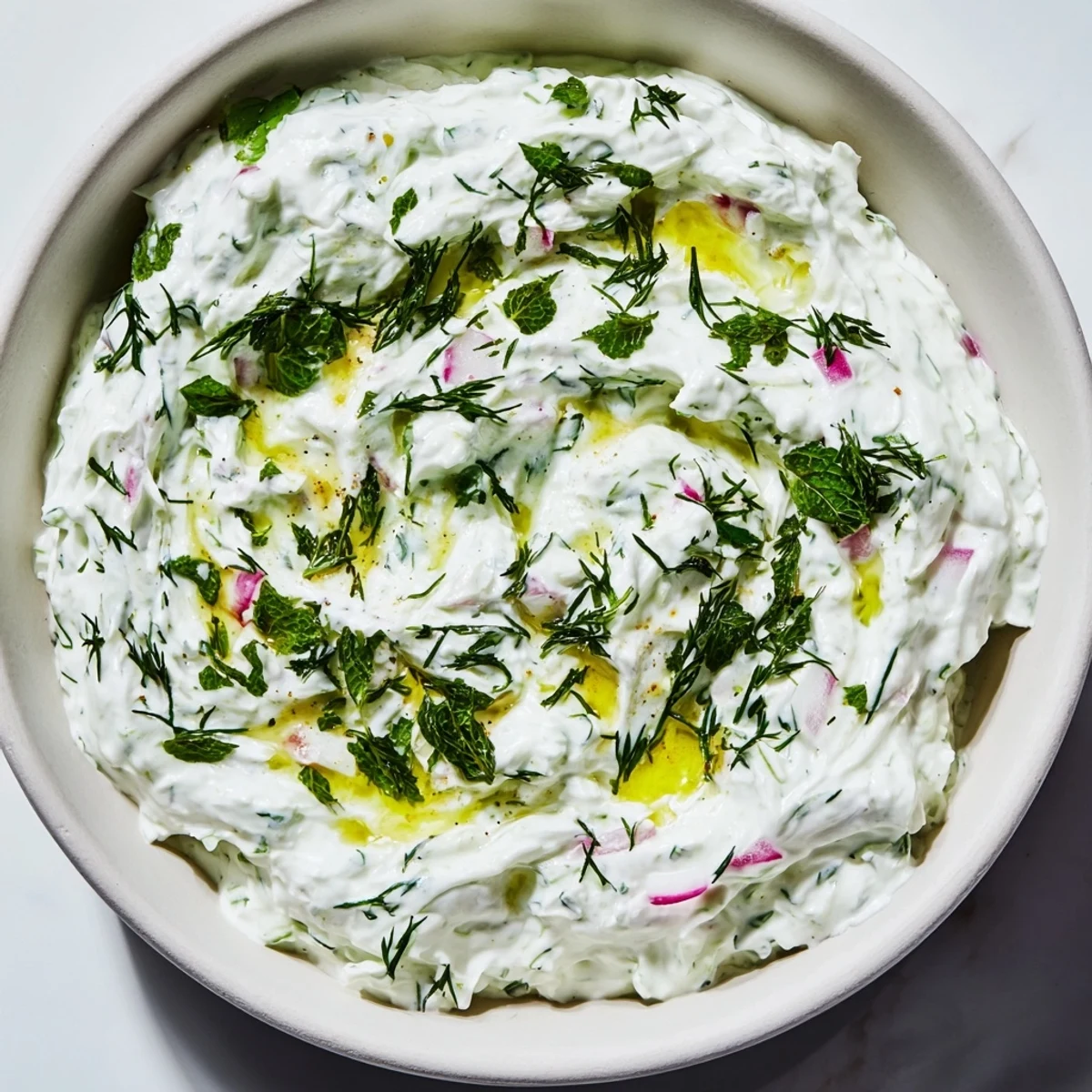 Crisp grated radishes and cucumbers folded into thick Greek yogurt for this refreshing healthy radish tzatziki dip