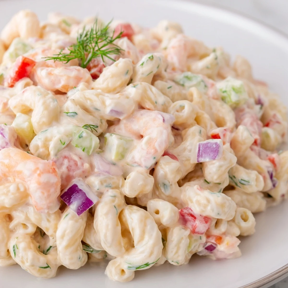 Chilled shrimp macaroni salad in a tangy mayonnaise dressing with fresh dill