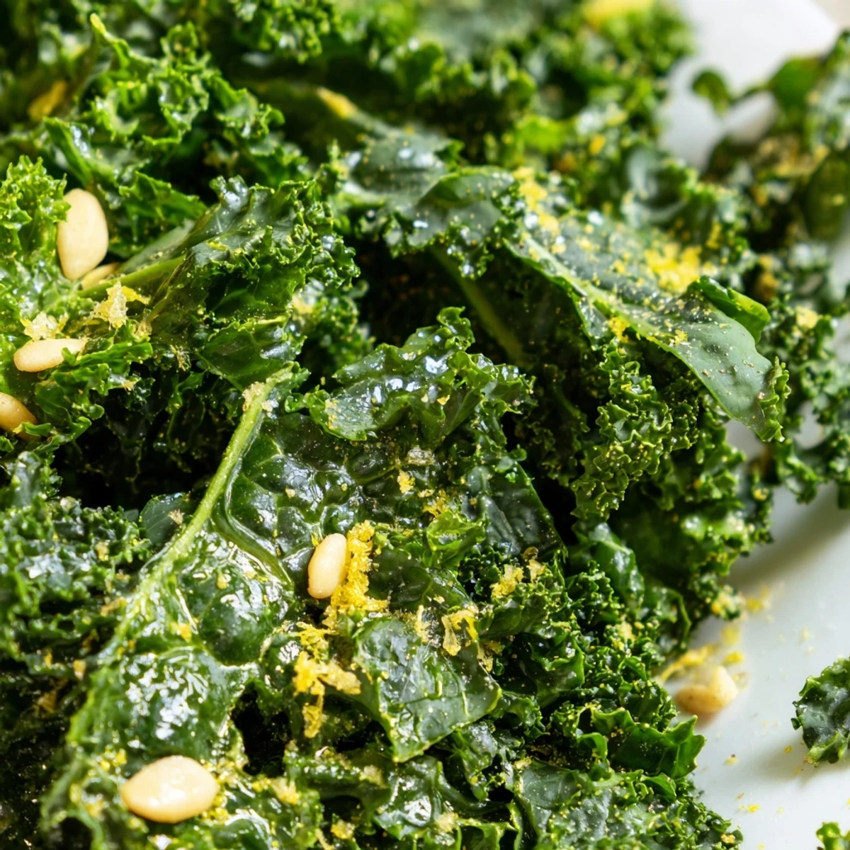 Fresh Garlic Lemon Parmesan Kale Salad in a rustic wooden bowl with shaved cheese