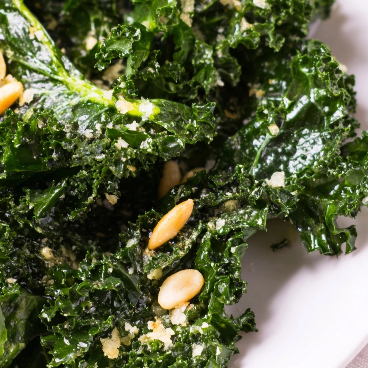 Massaged kale leaves glistening with zesty Garlic Lemon Parmesan Kale Salad dressing