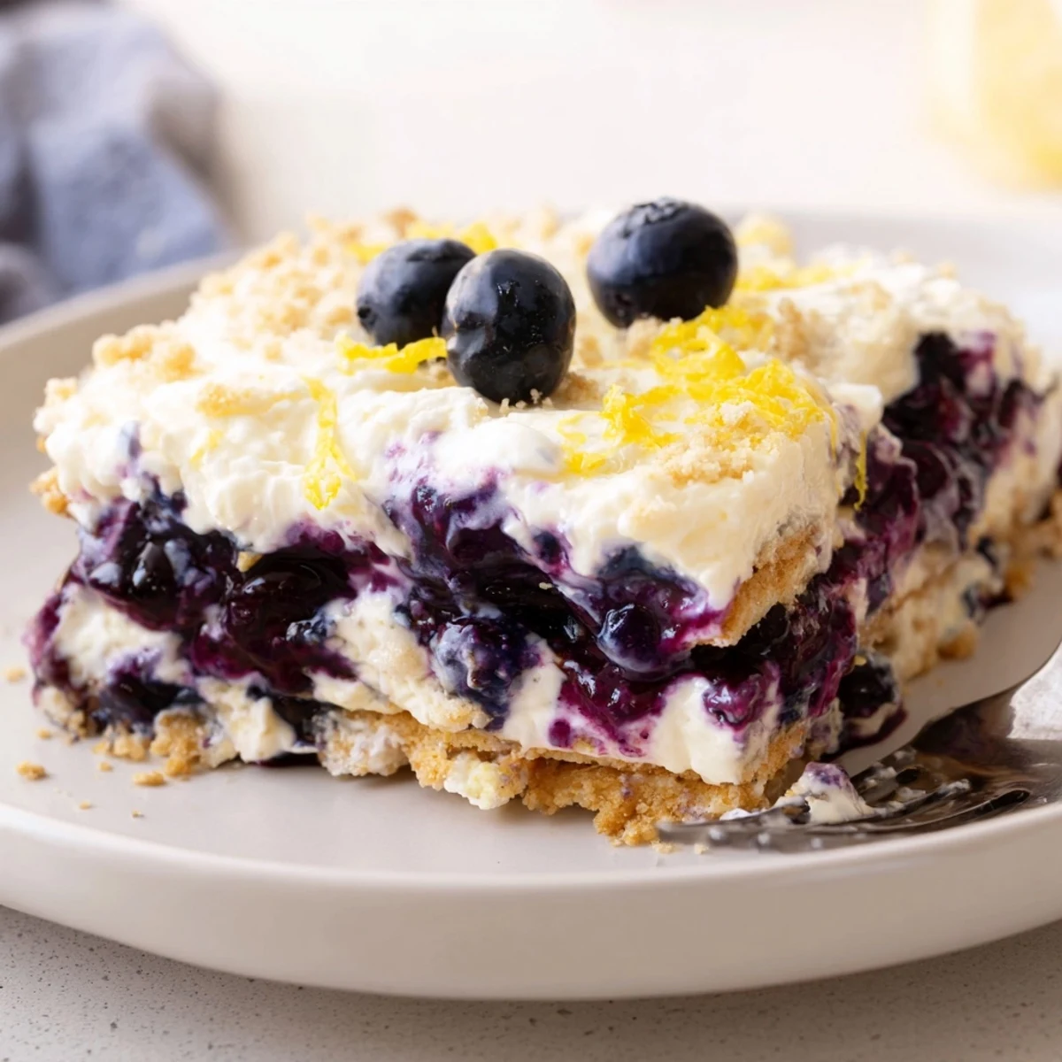Lemon Blueberry Lasagna Recipe showing chilled layers of creamy lemon and glossy blueberries