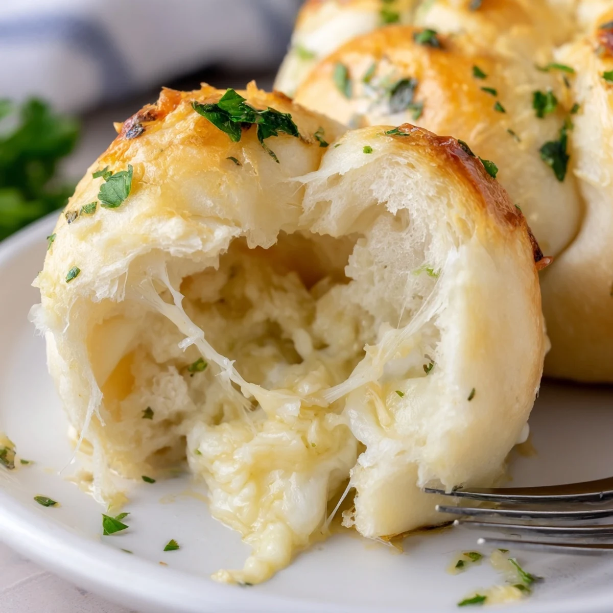Buttery Cheese Garlic Rolls with golden crust, oozy cheese, steam rising