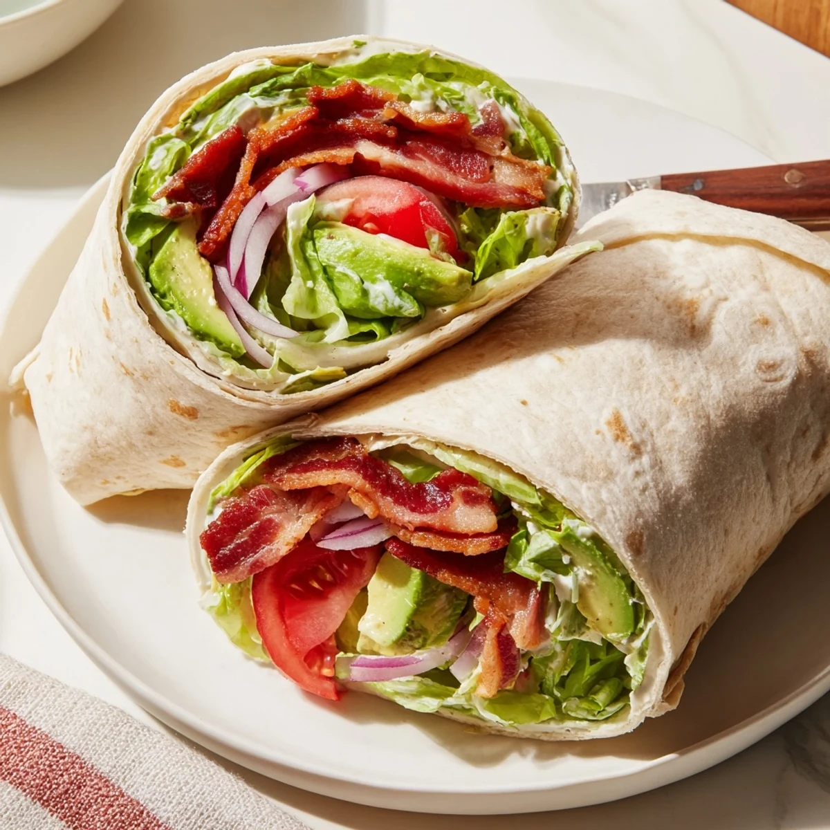Meal Prep BLT Wraps with crispy bacon, juicy tomatoes, creamy dressing ready for lunch