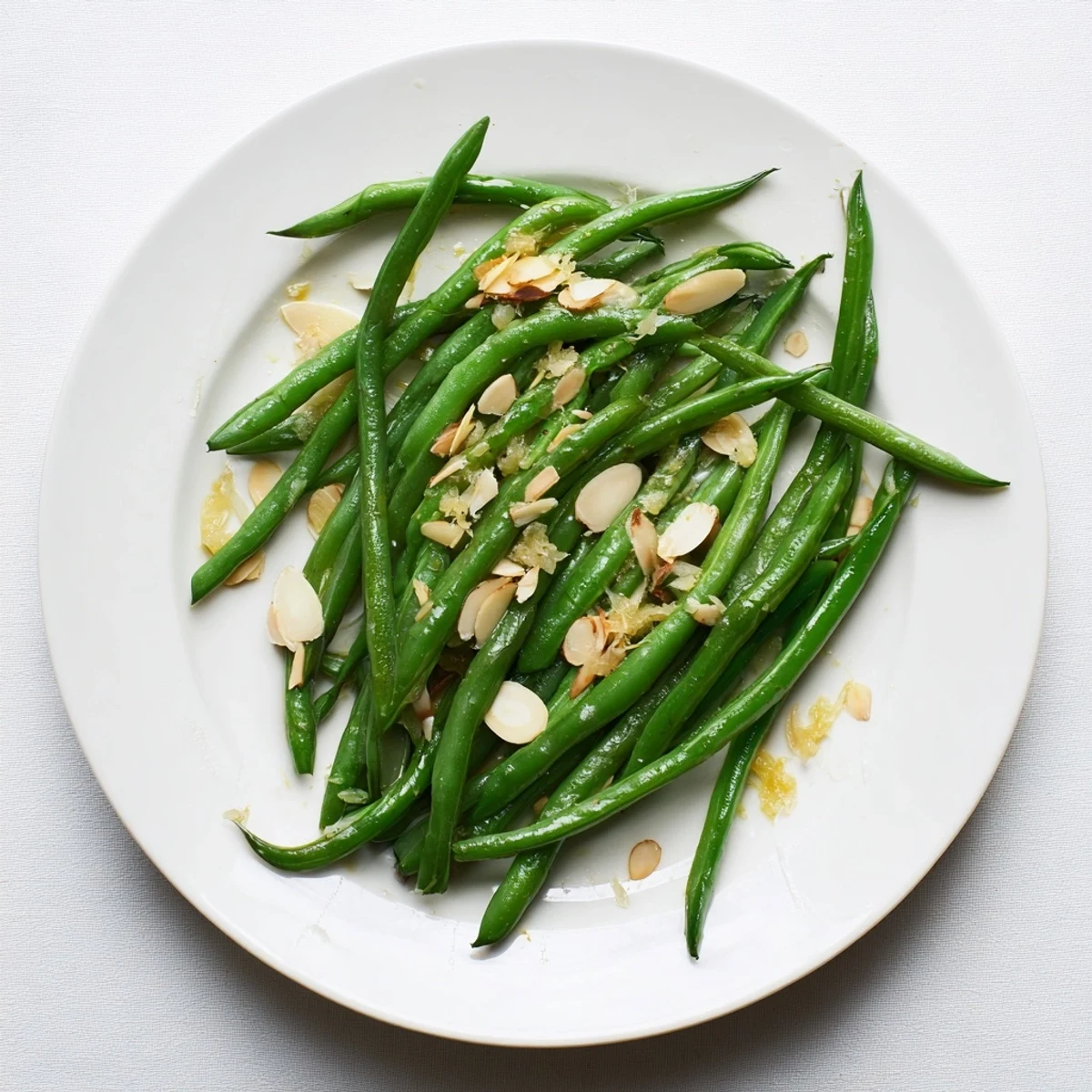 Garlic green beans pan-fried until tender with a glossy olive oil coating and almonds