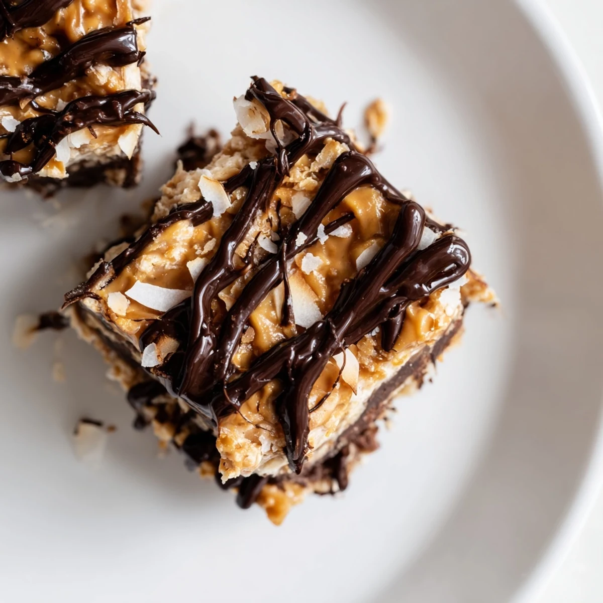 Chocolate-dipped no bake Samoa bites with toasted coconut and sticky caramel layer