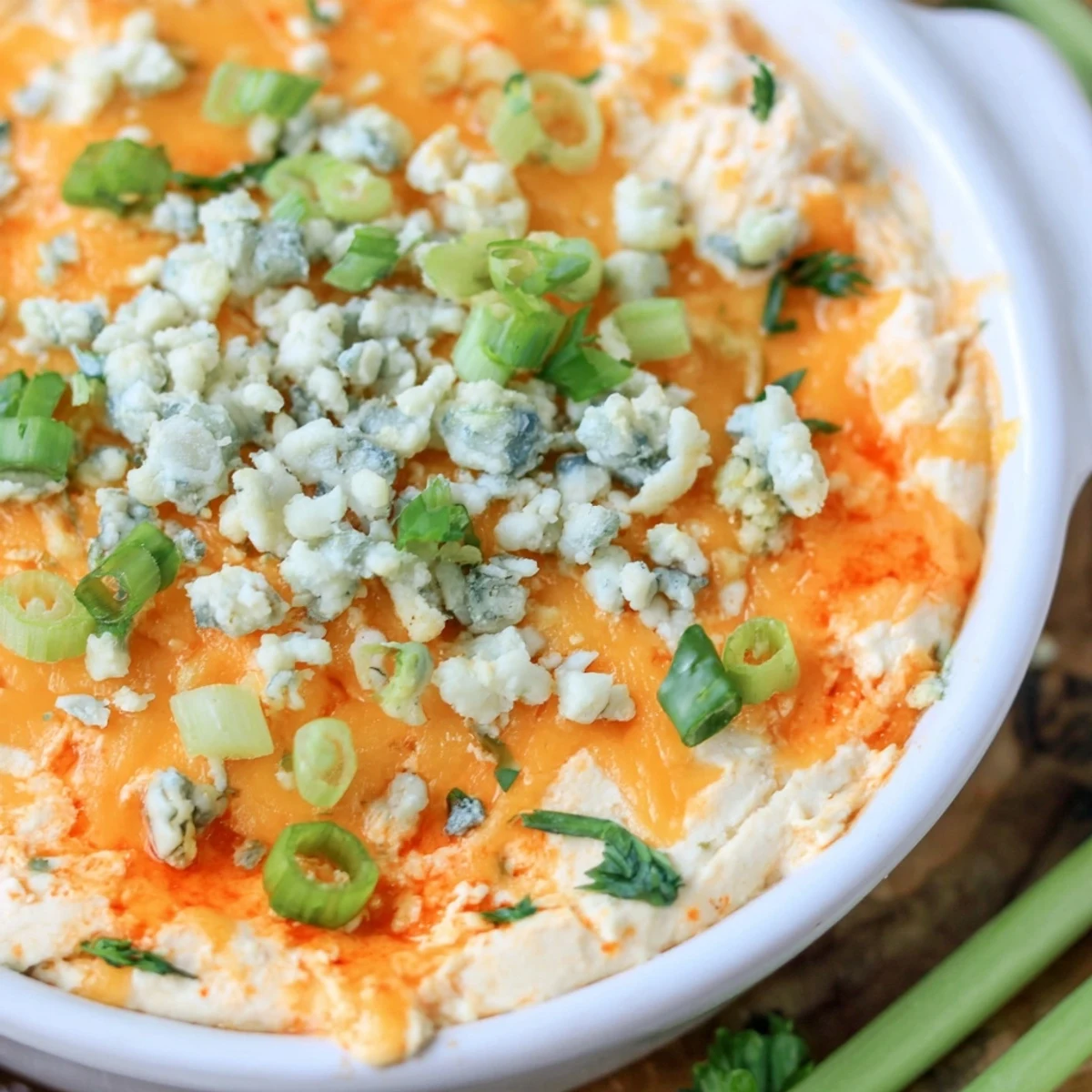 Steaming hot white bean buffalo dip with tortilla chips ready for game day parties