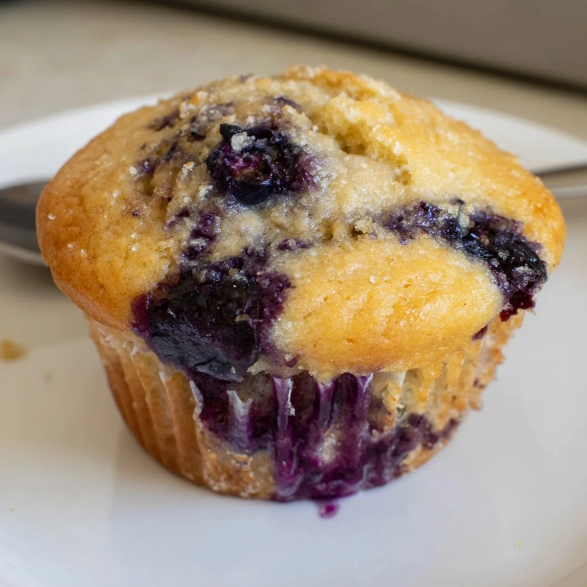Homestyle Blueberry Banana Muffins, tender centers, cinnamon hint, perfect grab-and-go breakfast.