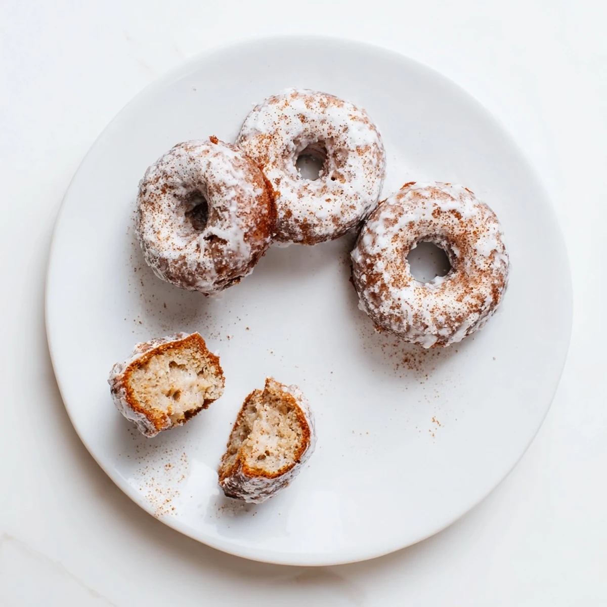 Stacked Banana Donuts dusted with cinnamon sugar, ideal for breakfast sharing