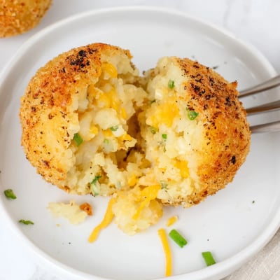 Crispy Fried Mashed Potato Balls served with ranch and spicy ketchup dip.
